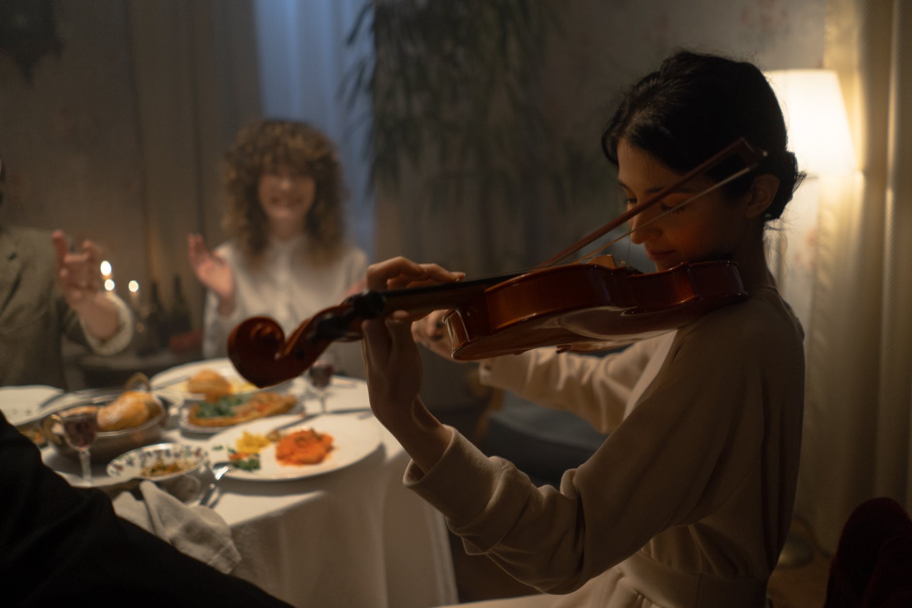 woman playing violin for entertainment