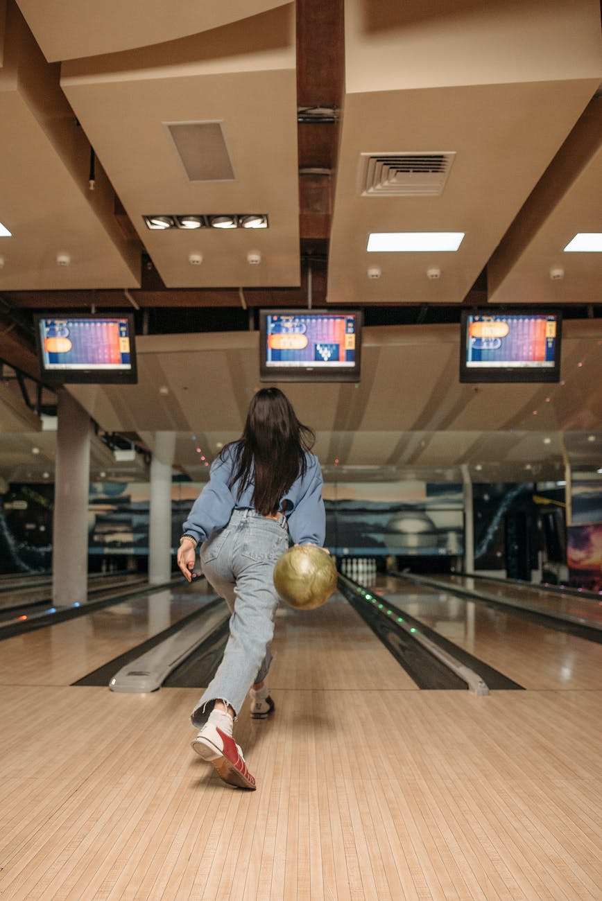 a woman playing bowling